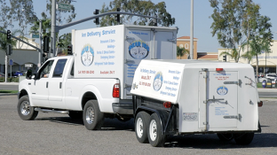 Ice delivery truck supplying ice to client