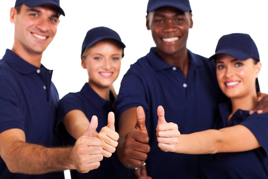 group of service staff thumbs up on white